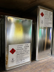 Pure acetone in 4 litre tins with hazard labels